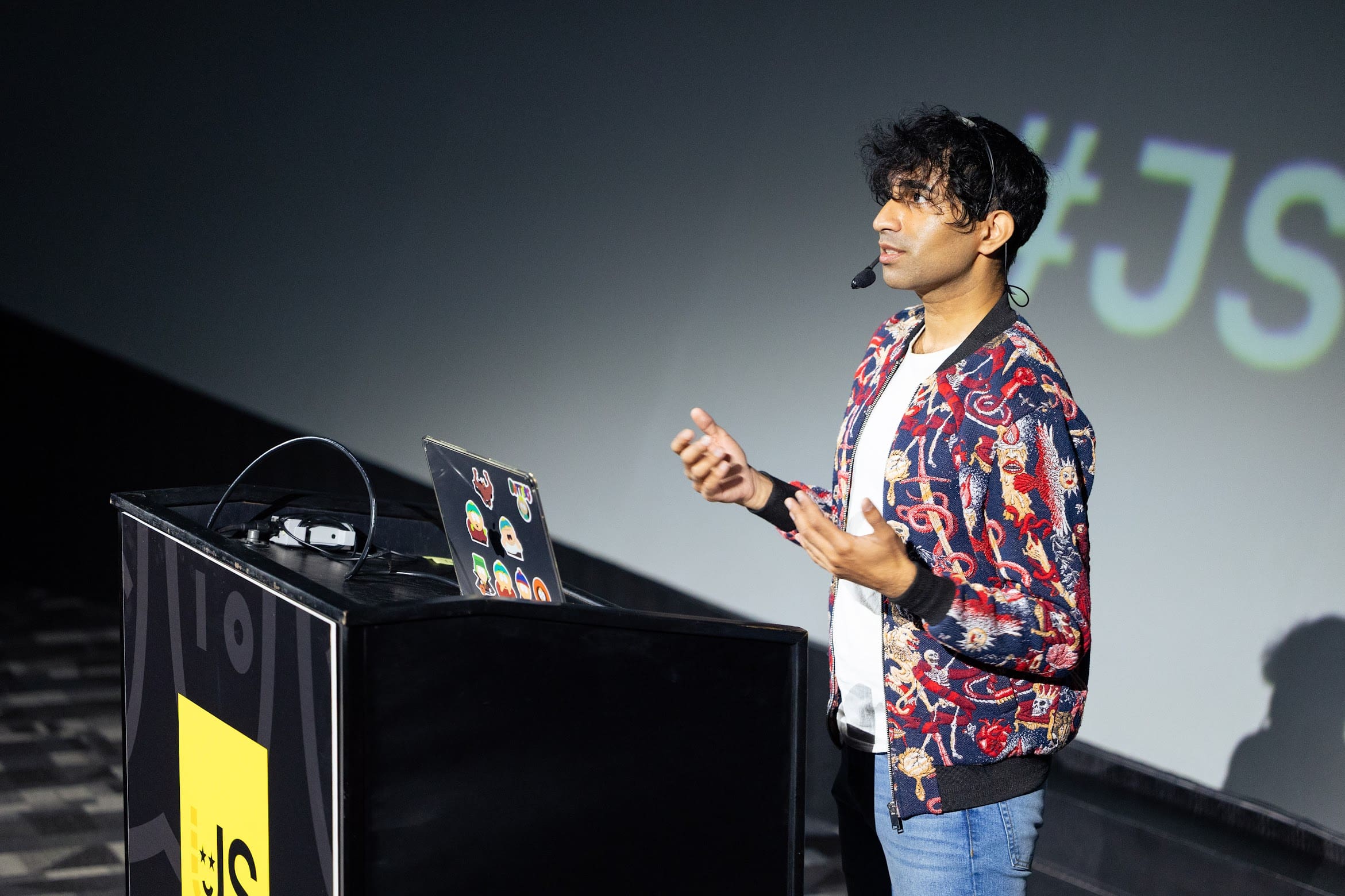 Addy speaking at a conference in 2025.
